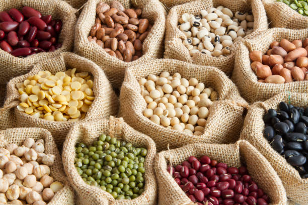 various of legumes in sack bag. organic food and creation of natural product concept.